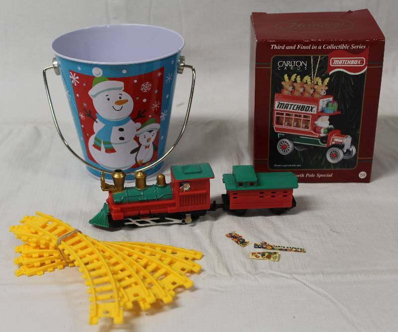 lot 9348 image: Christmas Matchbox Ornament, Train Set, and Tin.