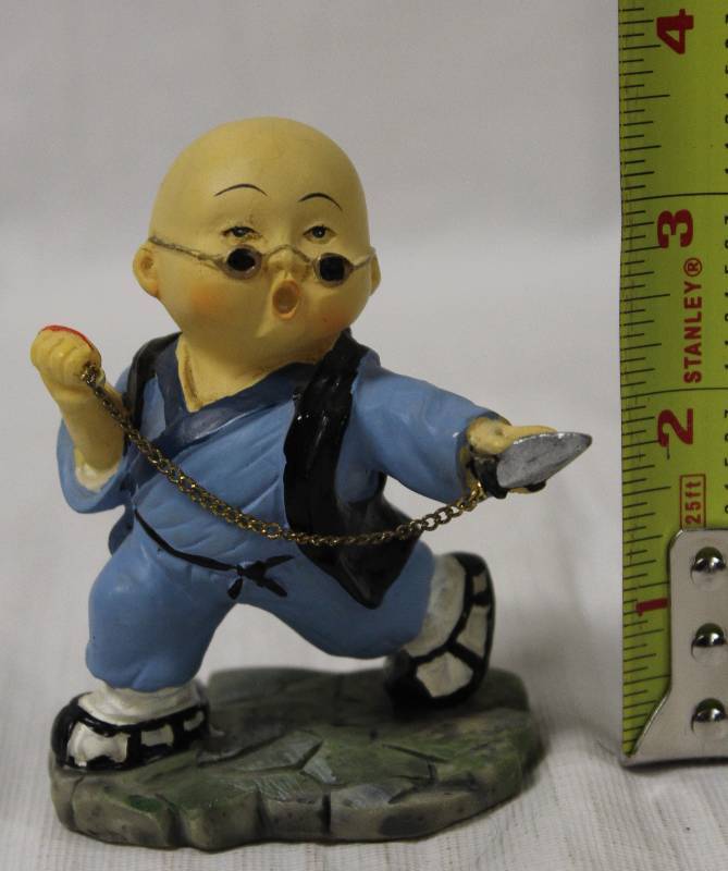 lot 9404 image: Small Asian Figurine with Fighting Stance.