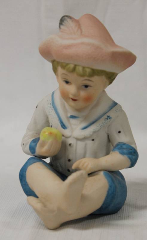 lot 9406 image: Ceramic Boy Figurine holding Apple