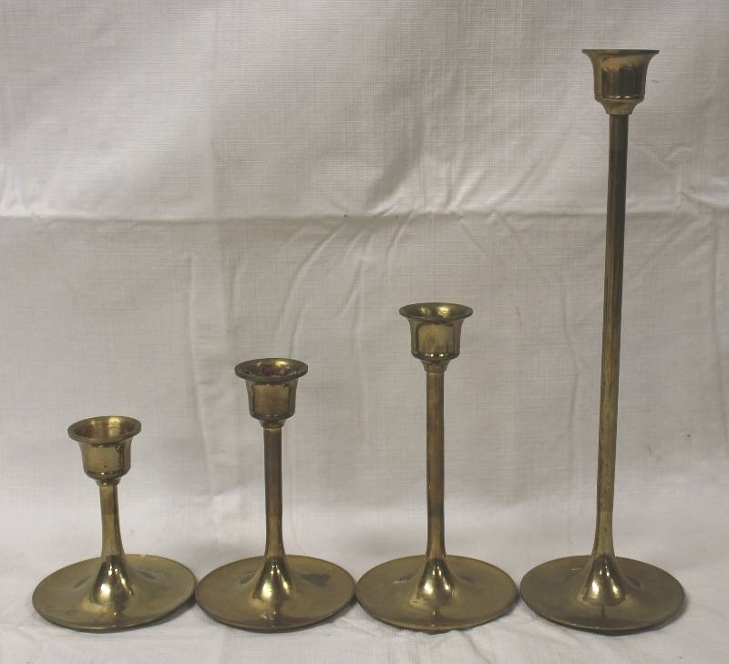 lot 9409 image: Set of 4 Brass Candle Stick Holders. Various heights