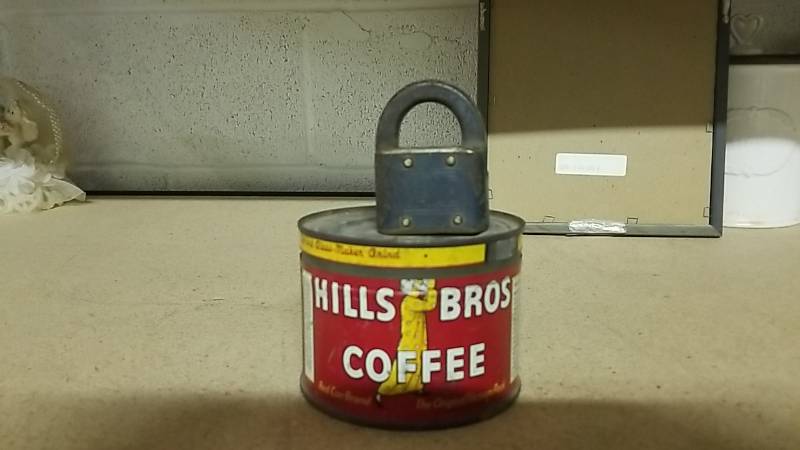 lot 16 image: Vintage Metal Coffee Can and Yale Lock