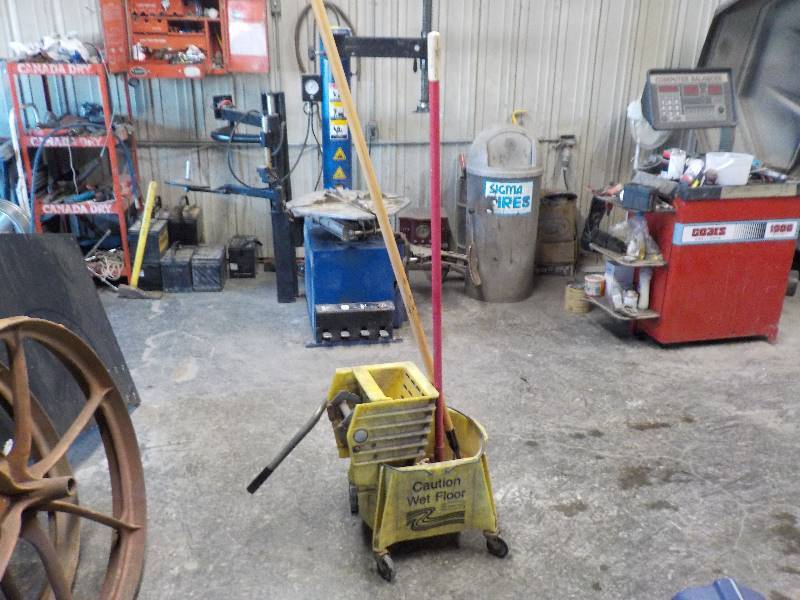 lot 3769 image: rubbermaid mop bucket w a mop and extra mop handle