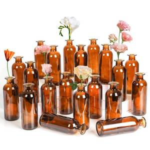 lot 83482 image: Amber Glass Bud Vase, 20 Pack 8 Oz Living Bud Vases, Small Vases for Flowers, Decorative Amber Bottles for Table Centerpiece, Home Decor, Office, Wedding Reception, Vintage Style