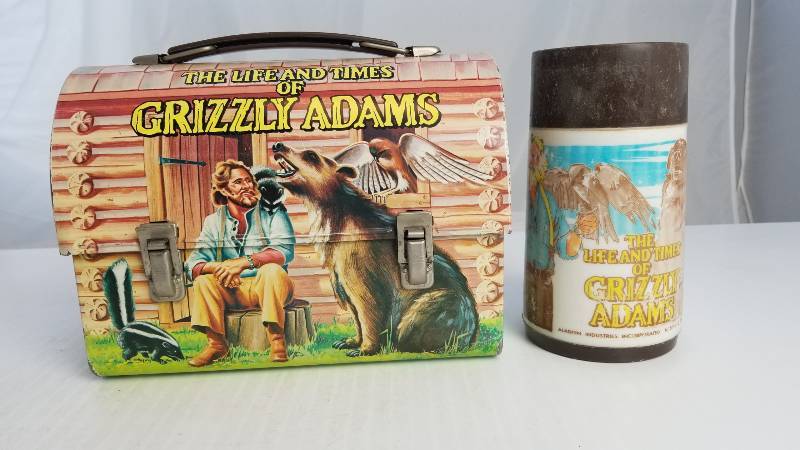 lot 3726 image: 1977 The Life andTimes of Grizzly Adams with Aladdin Thermo bottle  Vintage Metal Lunch Box