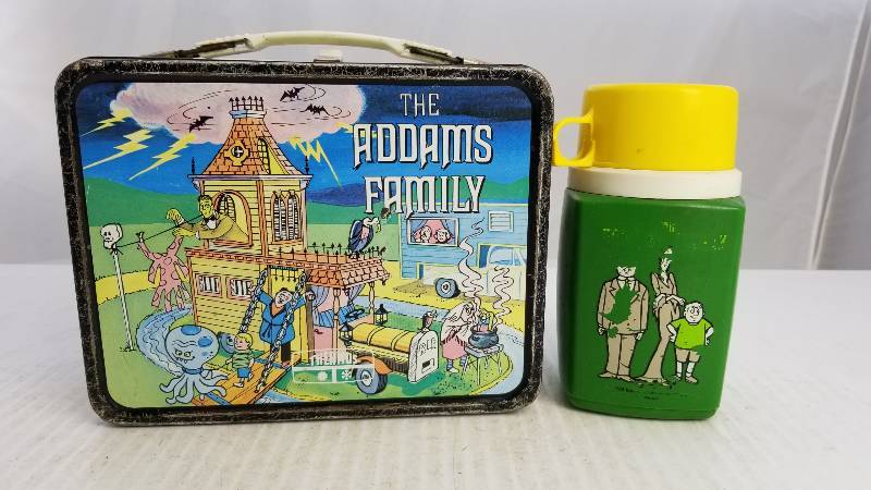 lot 3858 image: 1974 The Addams Family W 8oz King Seeley Thermos Vintage Metal Lunch Box