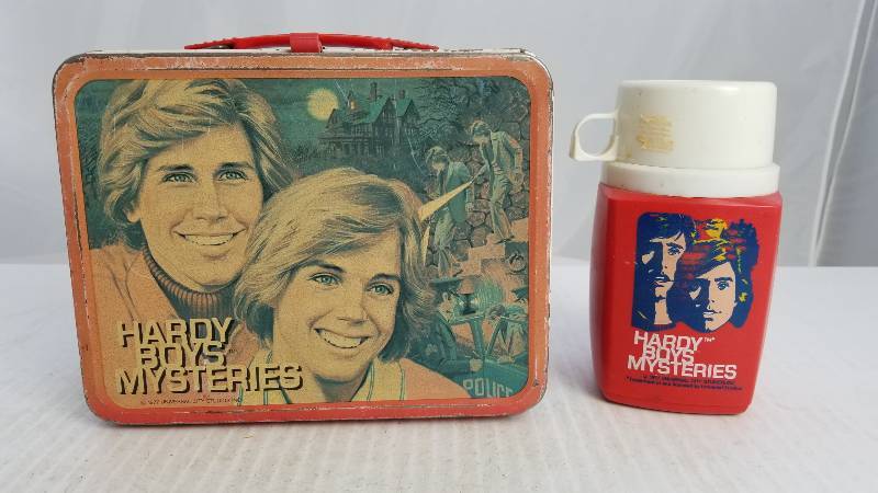 lot 3863 image: 1977 The Hardy Boys W 8oz king Seeley Thermos Vintage Metal Lunch Box
