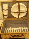 Picnic basket with plates cups and silverware as pictures