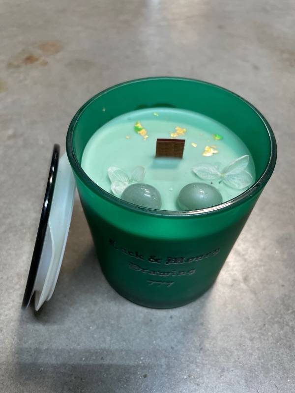 lot 3041 image: Angel number collection luck and money drawing 777 woodwick candle with crystals (unable to locate info on candle so size and scent is unknown, but we believe this has a melon scent, smells so good)