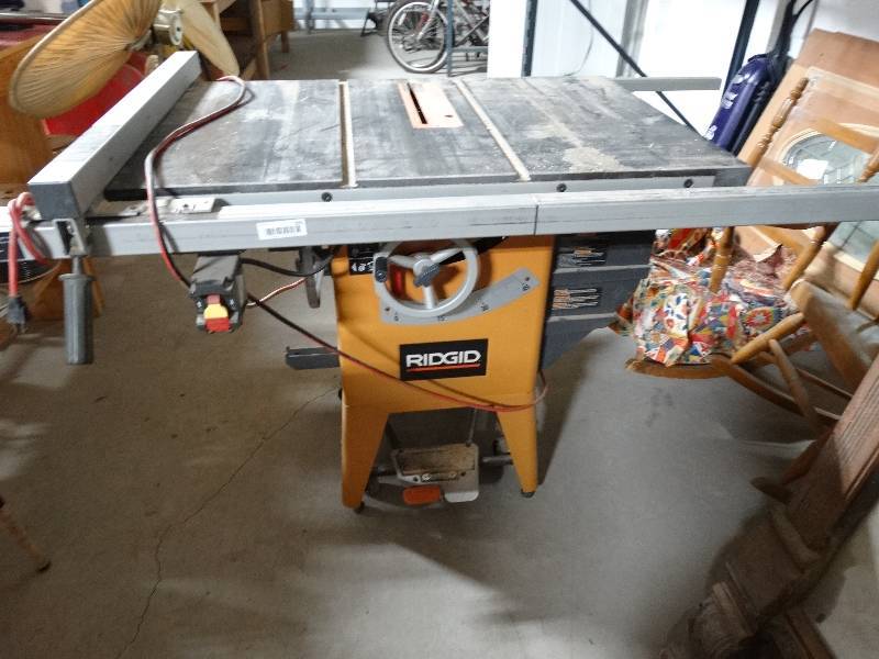 lot 295 image: Ridgid 10 table saw w wheels