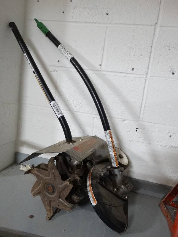 lot 328 image: 2- Troy-Bilt weed eater attachments