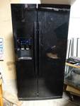 Black Samsung side x side refrigerator w/ ice & water in door