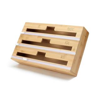 lot 92390 image: Rae Dunn 3 in 1 Wrap Organizer with Cutter, Plastic Wrap, Aluminum Foil and Wax Bamboo Dispenser for Kitchen Storage Organization Holder for 12 Roll