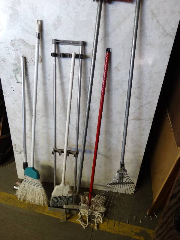 lot 920 image: Rack, rake, mop and brooms.