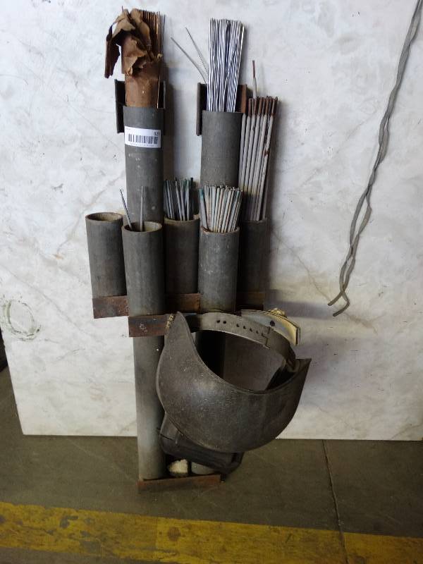 lot 927 image: Welding supplies, helmet and metal rack.