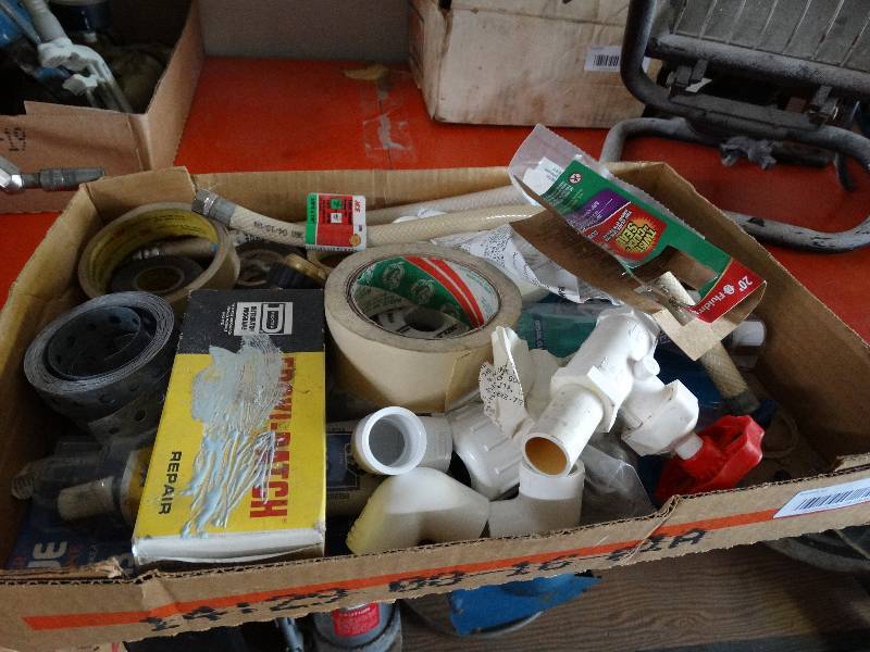 lot 937 image: Masking tape, electric tape, and pipe accessories.