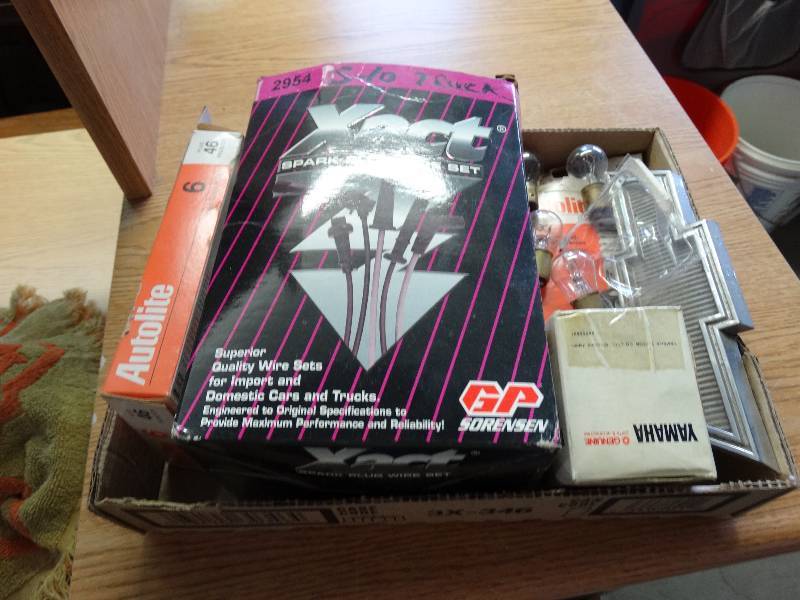 lot 957 image: 2 autolite copper spark plugs, spark plug wire set, and bulbs.