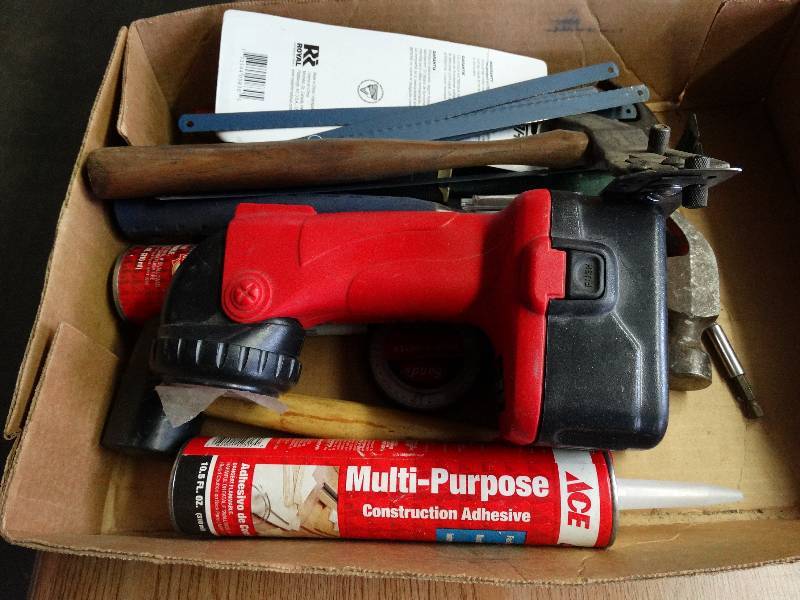 lot 1010 image: Lot of assorted tools and construction adhesive.