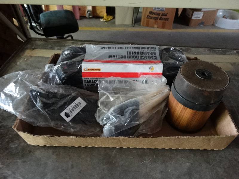 lot 1113 image: Garage door bottom weather seal, and pencil sharpener.
