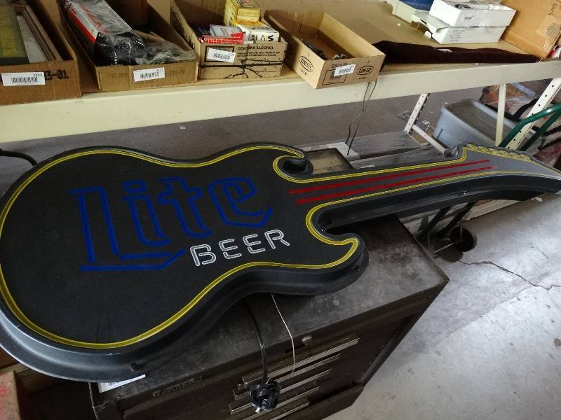 lot 1116 image: Hanging lighted lite beer guitar sign.
