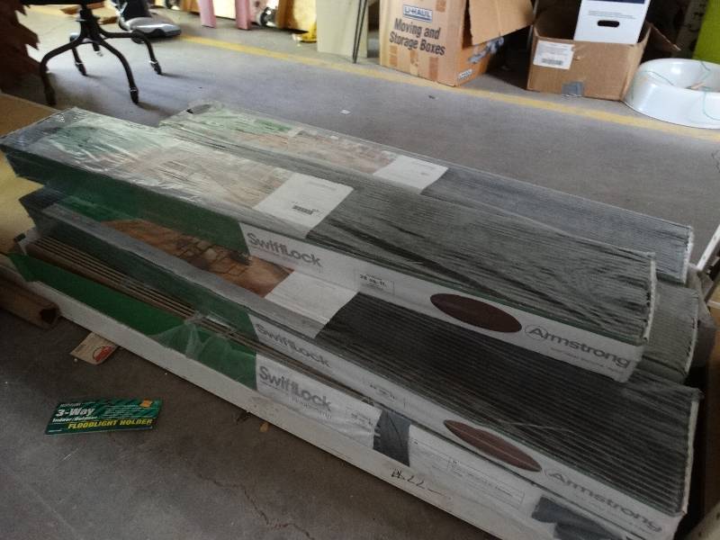 lot 1121 image: Swiftlock, 7 packages of luxury laminated flooring, 28sqft per package.