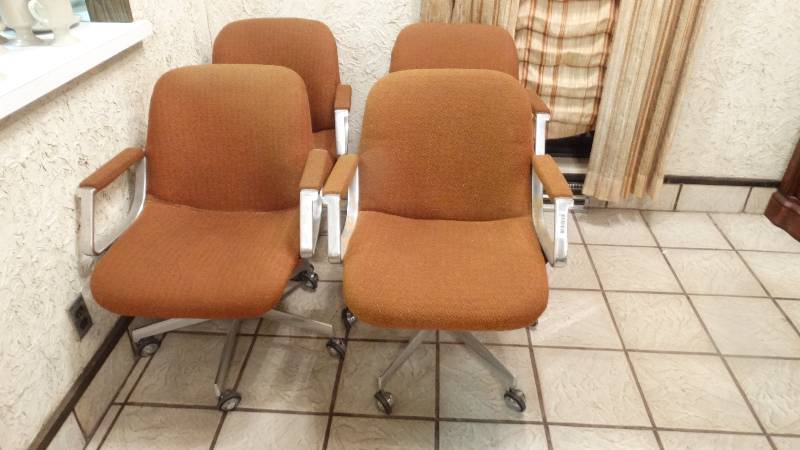 lot 101 image: 4 vintage dining chairs on wheels.