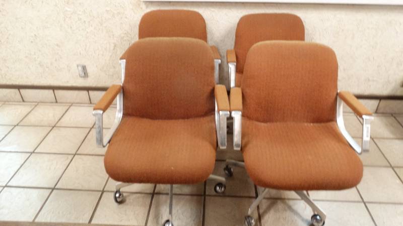 lot 102 image: 4 vintage dining chairs on wheels.