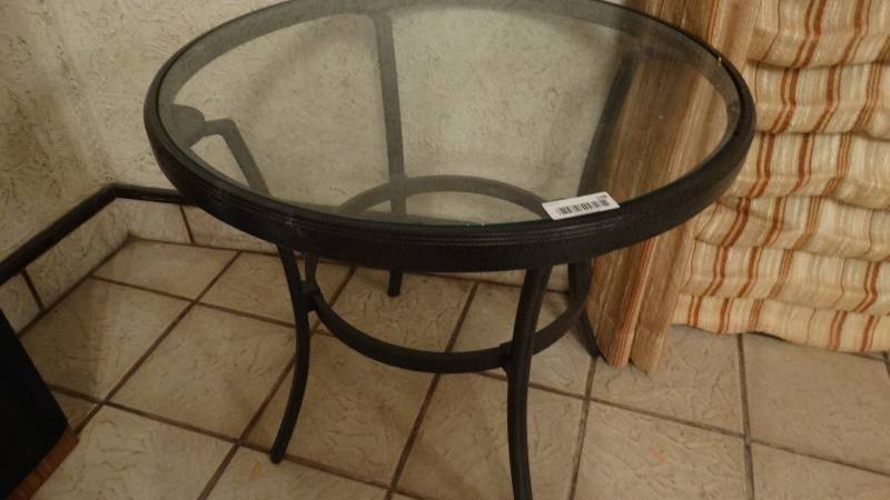 lot 108 image: Round glass top metal table