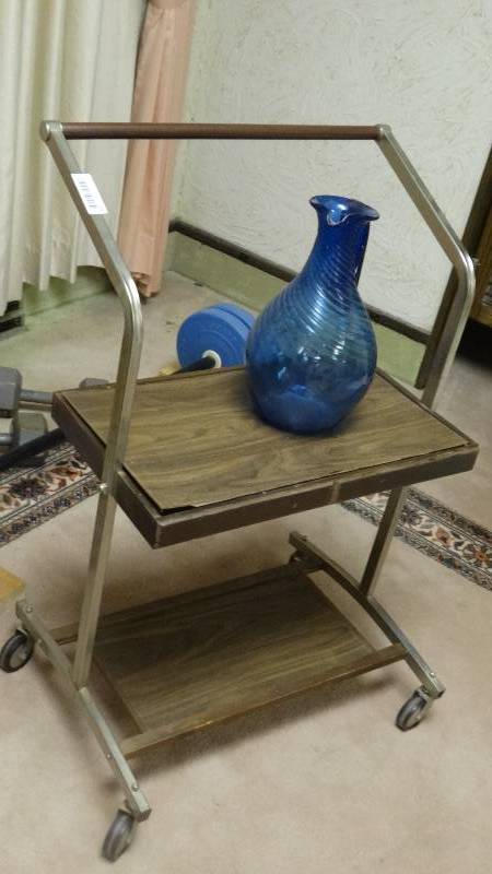 lot 277 image: Metal stand on wheels & blue glass pitcher