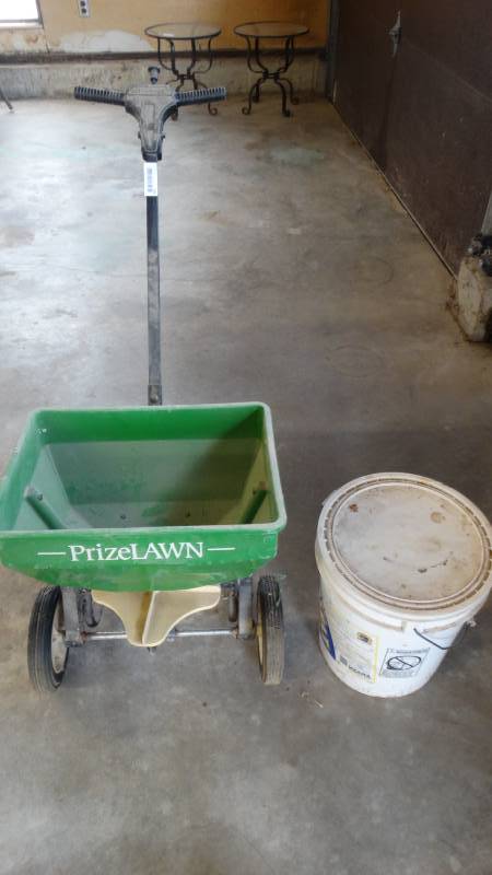 lot 350 image: Lawn spreader & bucket of ice melt