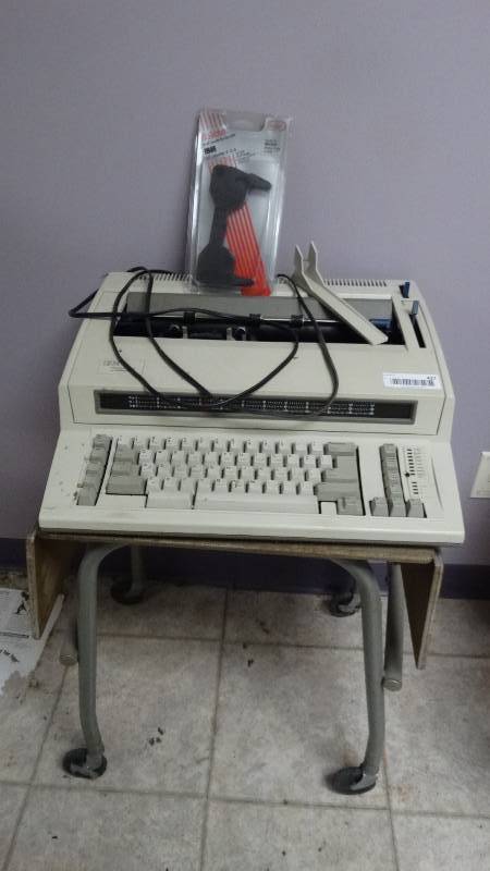 lot 427 image: Typewriter w metal stand on wheels