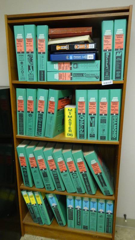 lot 438 image: Bookshelf full of various manuals.