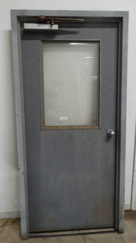 lot 540 image: Metal shop door w window & metal frame