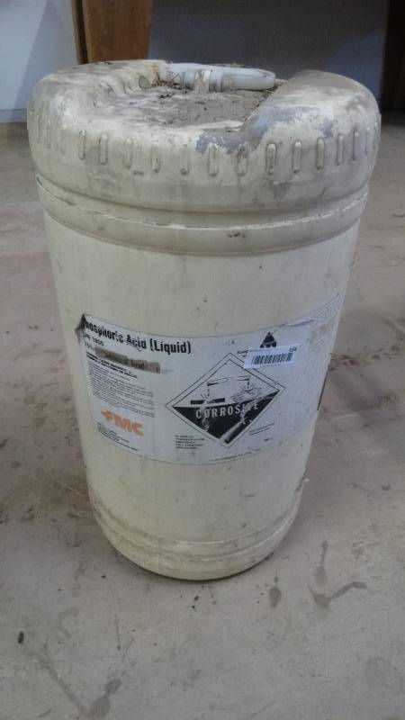 lot 556 image: Container of phosphoric acid- Approx. 5 gallons