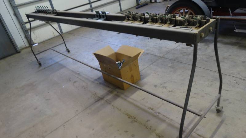 lot 557 image: 10 metal clamp stand on wheels w extra clamp holders
