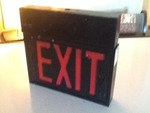 New exit sign one side or two-sided has light that shines out bottom with built-in battery pack