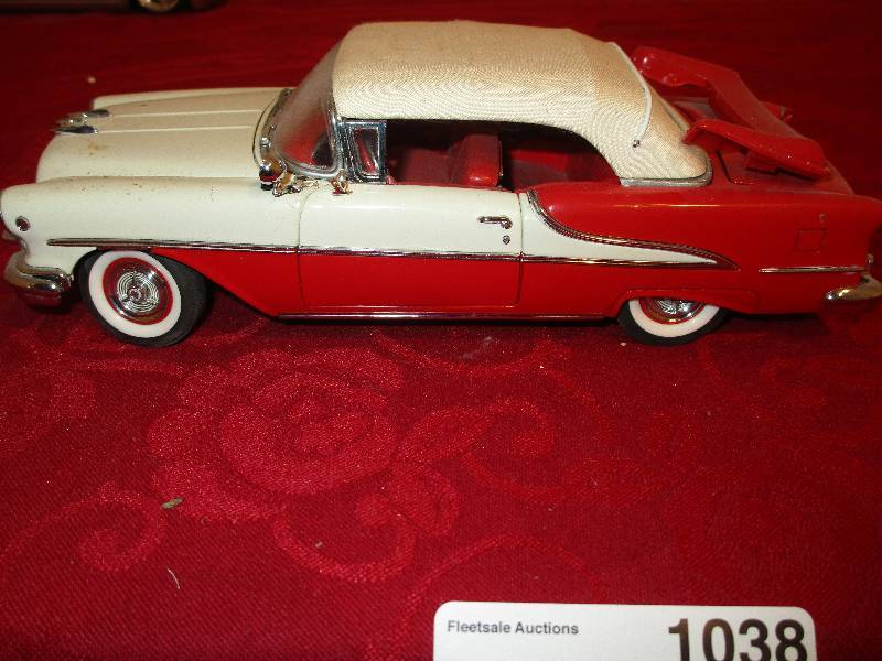 lot 1038 image: The Danbury Mint 1955 Olds Convertible Diecast