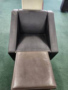 lot 48775 image: Stainless Steel And Black Faux Leather Accent Chair And Brown Leather Ottoman
