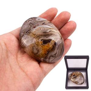 lot 1128 image: Gbuxska Banded Agate Palm Stone, Natural Polished Crystals Stones and Healing Stones for Anxiety, Reiki Healing and Crystal Grid, Irregular Shape Retail $9.99