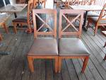 Pair Of Wooden Framed Vinyl Padded Chairs