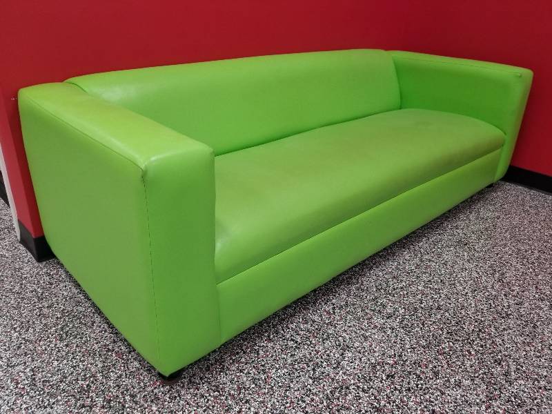 lot 1002 image: Green vinyl couch