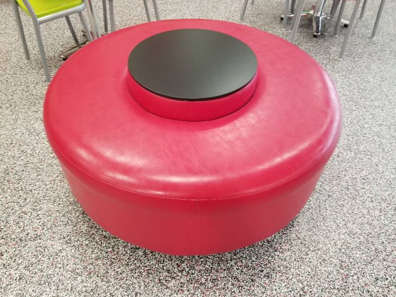 lot 1024 image: Round padded seat with table area in middle