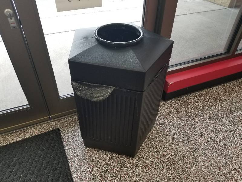 lot 1036 image: Black plastic trash can