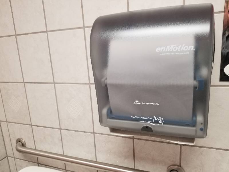 lot 1100 image: EnMotion paper towel dispenser and trash can