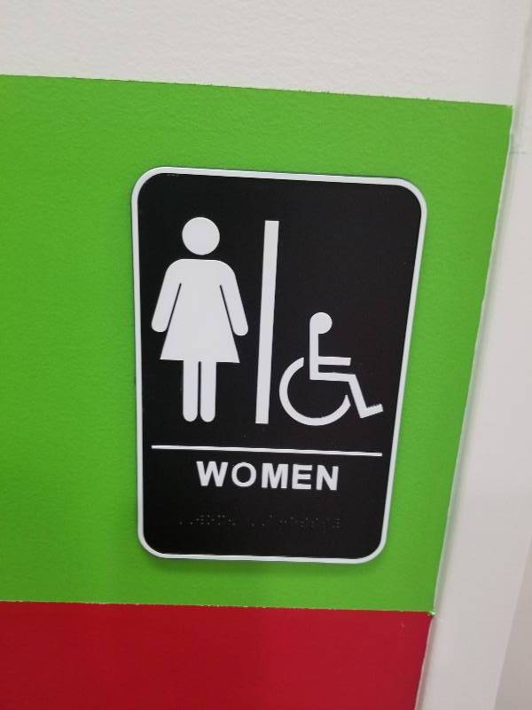 lot 1102 image: Men & Women bathroom signs