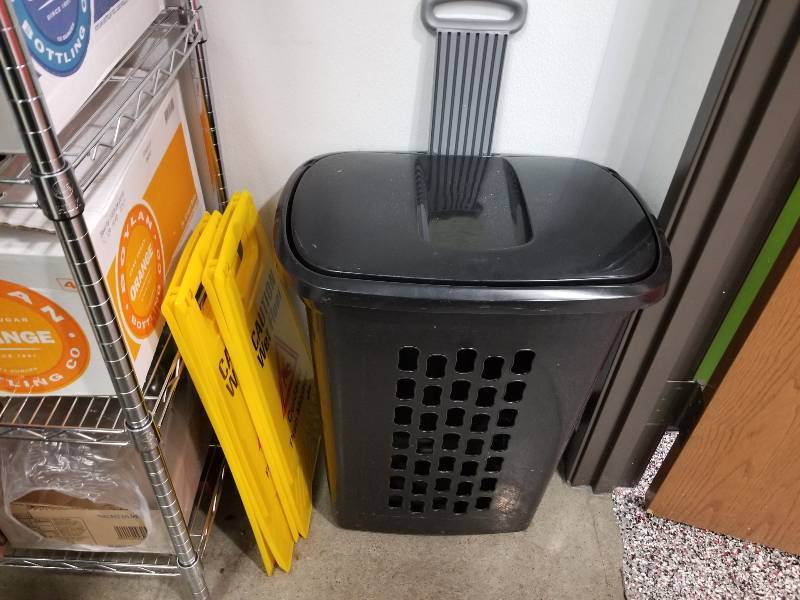 lot 1107 image: Clothes hamper and 2 wet floor signs