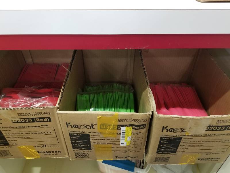 lot 1125 image: (3) partial boxes of red, pink, and green teaspoons