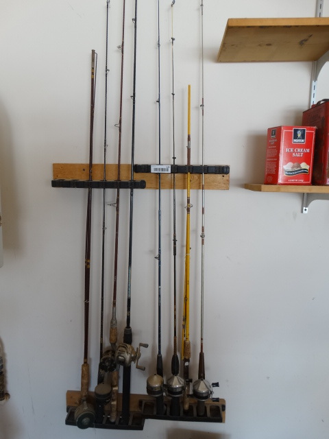 lot 125 image: 8 Fishing Poles7 Reels on Wall Rack.