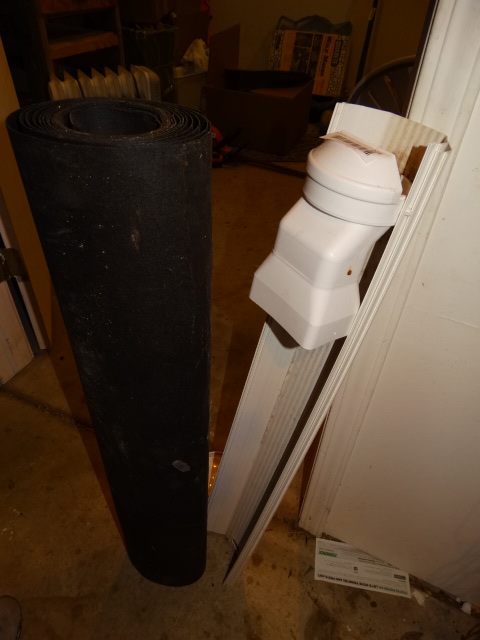 lot 221 image: Roll of Under-layment, PVC Guttering & Bucket of Concrete Patch.