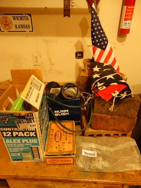 lot 249 image: Dap Clear Caulk, Decorative Rocks, Bricks, Rainbird Parts, Wood Block, Planter, Flag, PVC Fittings.