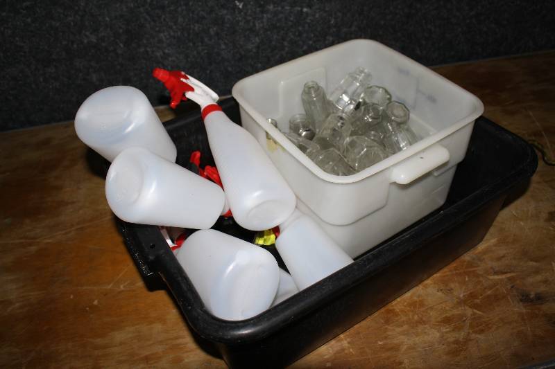 lot 3905 image: Bus Tub of Spray Bottles and SaltPepper Shakers